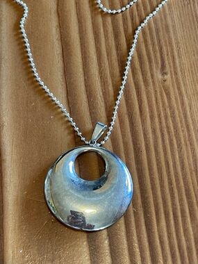 Sterling Silver pendant with silver chain.